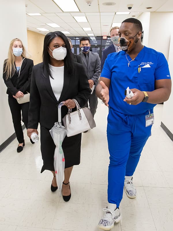 School of Dentistry Ambassador and second-year student Johntre Goudy talks with applicant Kierra Banks as fellow applicants, from left, Aubree Dillon, Jay Fritts and Dutton Day listen in.